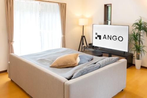 Una cama o camas en una habitación de ANGO ATAMI I
