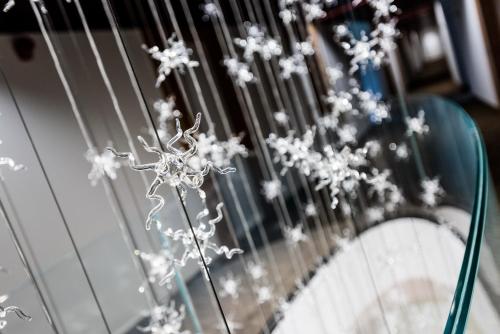a bunch of white flowers on a metal fence at Laguna Park Hotel 4Superior in Bibione