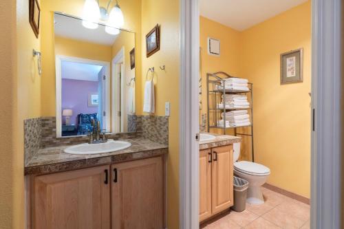 a bathroom with a sink and a toilet at Waters Edge 207 in Lincoln City