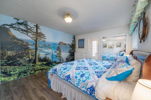 a bedroom with a bed and a painting of the ocean at Woodley Beach House in Lincoln Beach