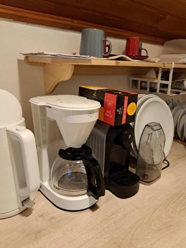 a coffee maker sitting on top of a counter at House Franja - Spa and relax in Kranjska Gora