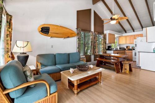 a living room with a couch and a table at New A/C Central Kona Surf House 4bd/4bth Sleeps8 in Kailua-Kona