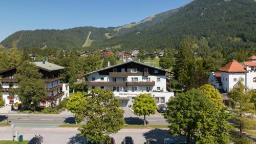 a view of a town with a mountain at LakeSide Apartments Seefeld in Seefeld in Tirol