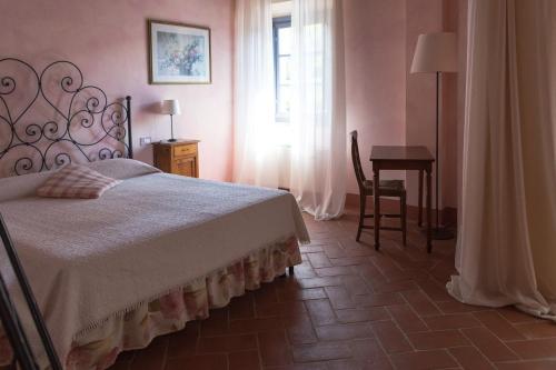 Postel nebo postele na pokoji v ubytování Il Borghetto Tuscan Holidays