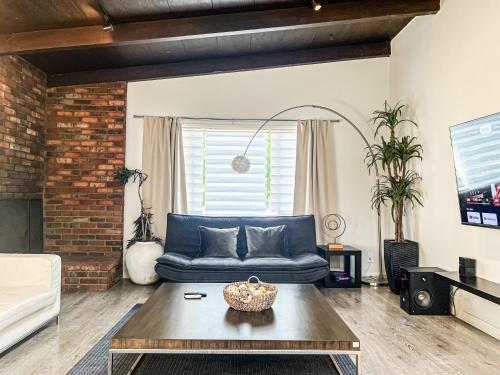 a living room with a couch and a table at Spacious 2BR unit in an Outstanding Location in Los Angeles