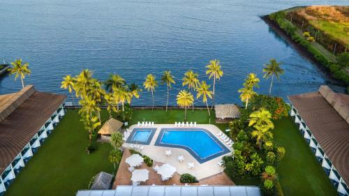 an aerial view of a resort with a swimming pool at Holiday Inn Suva, an IHG Hotel in Suva