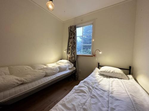 Postel nebo postele na pokoji v ubytování Cozy holiday house near Slite with nice baths