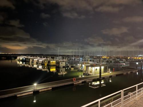a marina at night with a bunch of boats at Waterlife in Lisbon