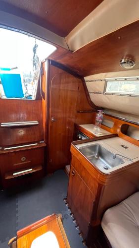 a kitchen with a sink in the middle of a boat at Waterlife in Lisbon