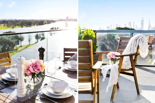 a table with plates and flowers on top of a balcony at New listing! Amazing Park River View Luxury 3B2B in Melbourne