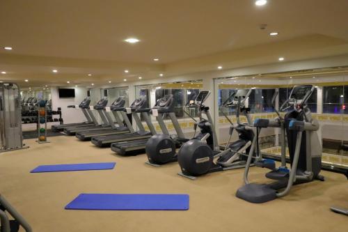 a gym with a row of tread machines at The Grand Kandyan in Kandy
