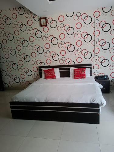 Tempat tidur dalam kamar di Hotel Mahati