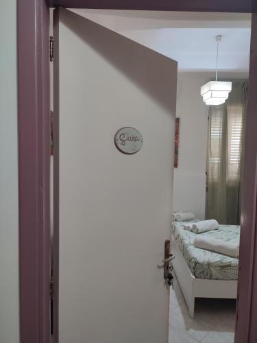 Postel nebo postele na pokoji v ubytování Don Mimí l'affittacamere