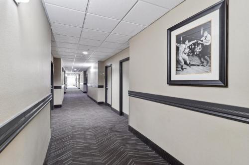 a hallway of an office building with a picture on the wall at Holiday Inn Hotel & Suites Slidell by IHG in Slidell