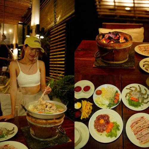 a woman standing in front of a table full of food at Escape Life Koh Kood in Ko Kood