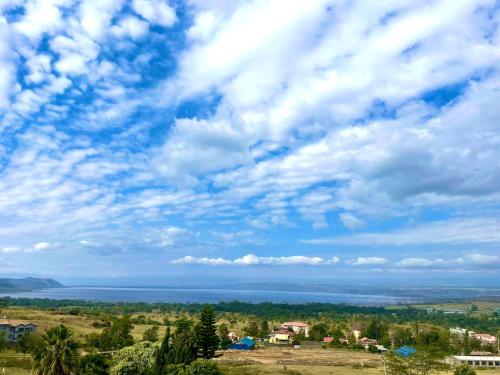 a view of the ocean under a cloudy sky at Xellent Suites- Marg House in Nakuru