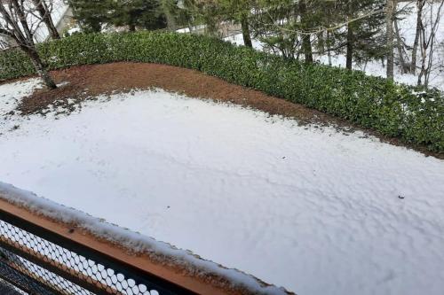 a pile of snow on the roof of a car at Rilassati al Corno alle Scale in Vidiciatico