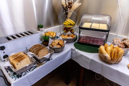 a table with bread and other foods on it at Hotel Bristol in Luxembourg