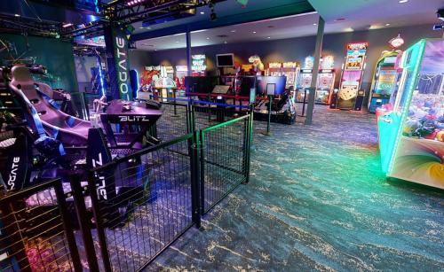 a gaming room with a video game system and a gaming console at Shangri-La Resort in Monkey Island