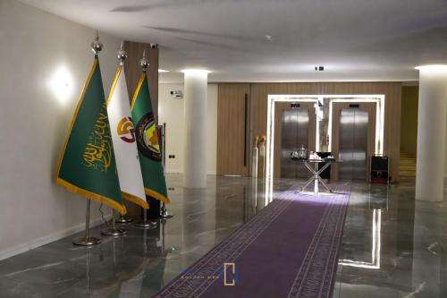 a lobby with flags on the floor of a building at فندق جولدن نيو الصفا - Golden New Al Safa Hotel in Jeddah