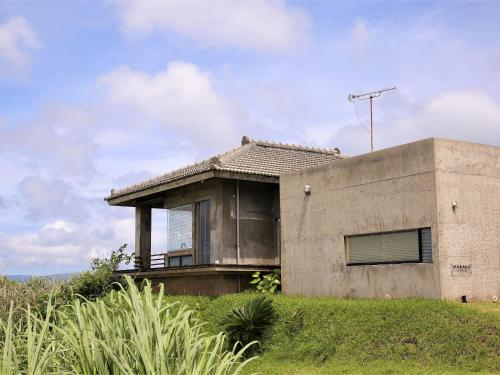 a house on top of a hill at Mukaka Villa in Nakijin