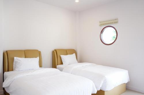 Postel nebo postele na pokoji v ubytování Chanmuang Resort ชานเมืองรีสอร์ท