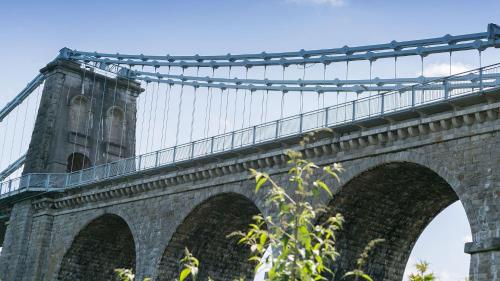 a bridge with a tower on top of it at Noddfa in Menai Bridge
