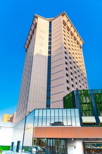 a tall building with a lot of windows at Stey Beijing Sanlitun Boutique Hotel in Beijing