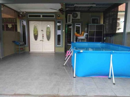 a pool table in the middle of a room at 3Bedroom Full AirCond House with Pool@PortDickson in Port Dickson