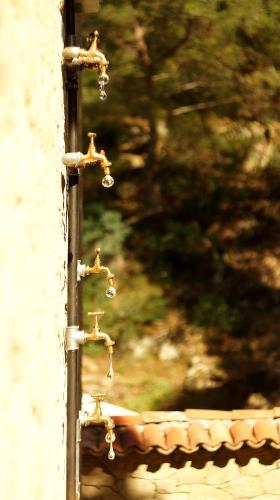 a close up of a water faucet on a roof at Kazdaglari Karye Müze Hotel in Kucukkuyu