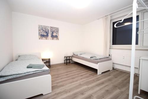 מיטה או מיטות בחדר ב-Nice Apartment in Hagen
