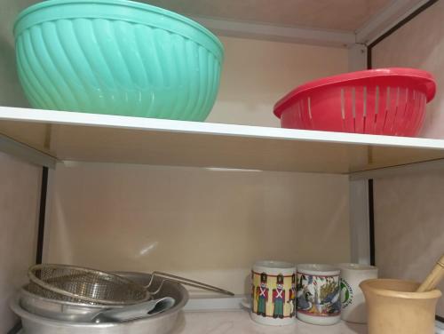 two bowls on a shelf in a refrigerator at شاليه رائع مجدد للعائلات فقط باندلسيه مطروح in Marsa Matruh