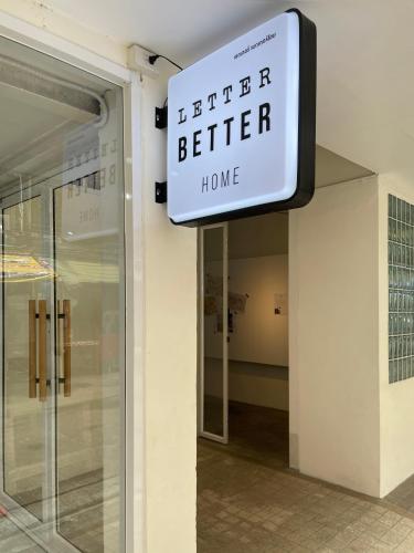 a better better home sign on the side of a building at Letter Better Home in Bangkok