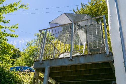 a building with a balcony on the side of a building at The Moorings in Menai Bridge
