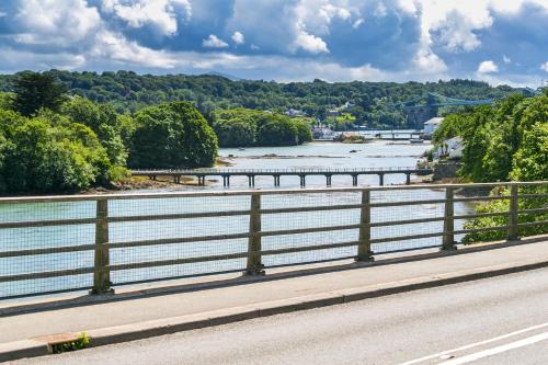 a view of a river from a bridge at The Moorings in Menai Bridge