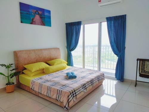 a bedroom with a bed and a large window at Palmyra Residence in Kajang