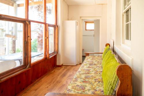 a couch in a room with a window at De Rusty Farm in De Rust