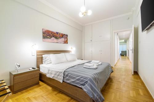 a bedroom with a large bed in a room at Urban Luxury on a Quiet Street in the Center of Athens in Athens