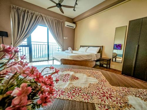 a hotel room with two beds and a balcony at Armani Soho Subang Jaya by Idealhub in Subang Jaya