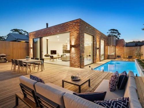a house with a swimming pool and a patio at LUXE Poolside living, in the heart of Flinders in Flinders
