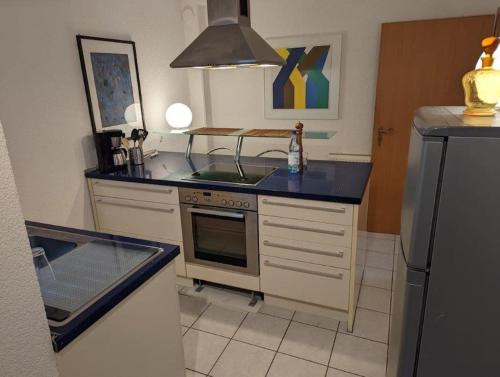 a kitchen with a sink and a stove top oven at Ferienwohnung in Göppingen in Göppingen