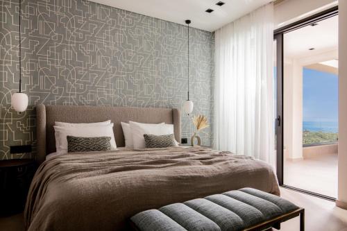 a bedroom with a large bed with a wall mural at Eran Luxury Villa with Private Pool & Sea Views, by ZanteWize in Akrotiri