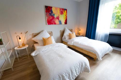 Postel nebo postele na pokoji v ubytování BetterBeds Gelsenkirchen
