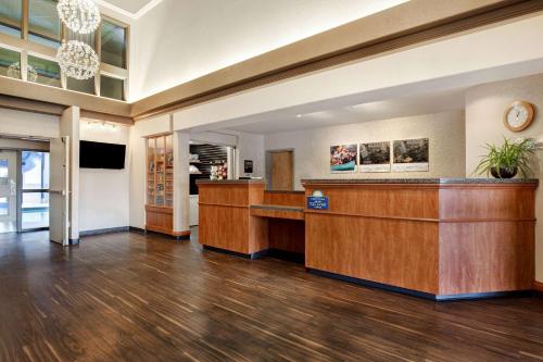 a lobby of a hotel with a reception desk at Days Inn by Wyndham Medicine Hat in Medicine Hat