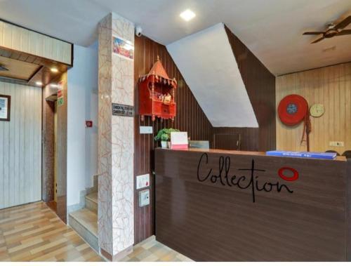 a restaurant with a counter in a room at CORAL TREE INN in Lucknow