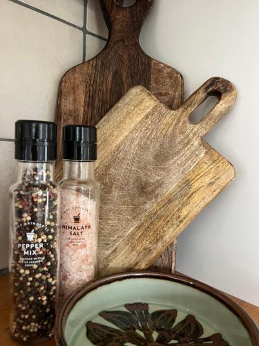 a wooden tea pot and a plate with some spices at Kaffestugan in Hällefors