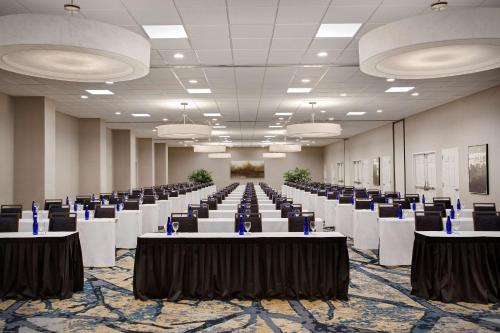a large room with tables and chairs in it at Embassy Suites by Hilton Orlando International Drive Convention Center in Orlando