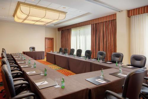 a conference room with long tables and chairs in it at Hilton Seattle Airport & Conference Center in SeaTac