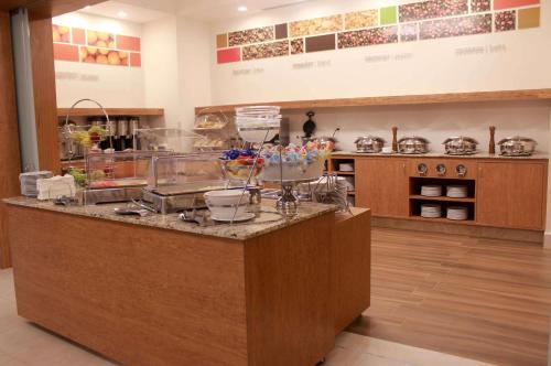 a kitchen with a counter with food on it at Hampton Inn by Hilton Merida in Mérida