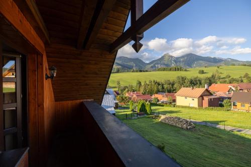 a view from the porch of a house with a view of the mountains at Chalupa Beliankovo in Ždiar